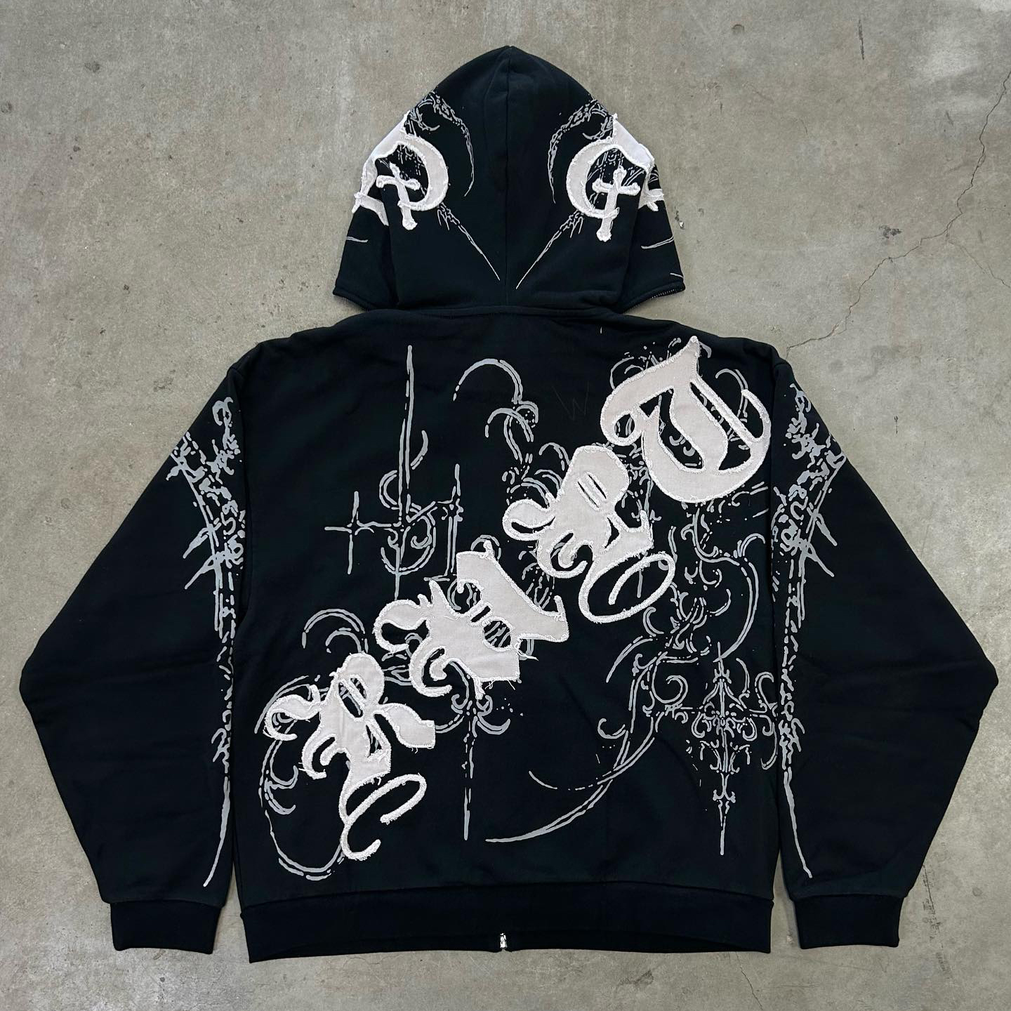 Cross appliqué printed zip-up hoodie