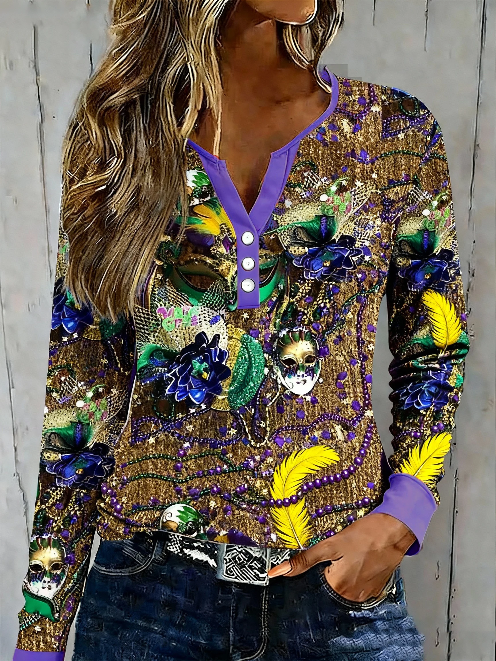 Women's casual carnival-themed top with beaded mask print and buttons.