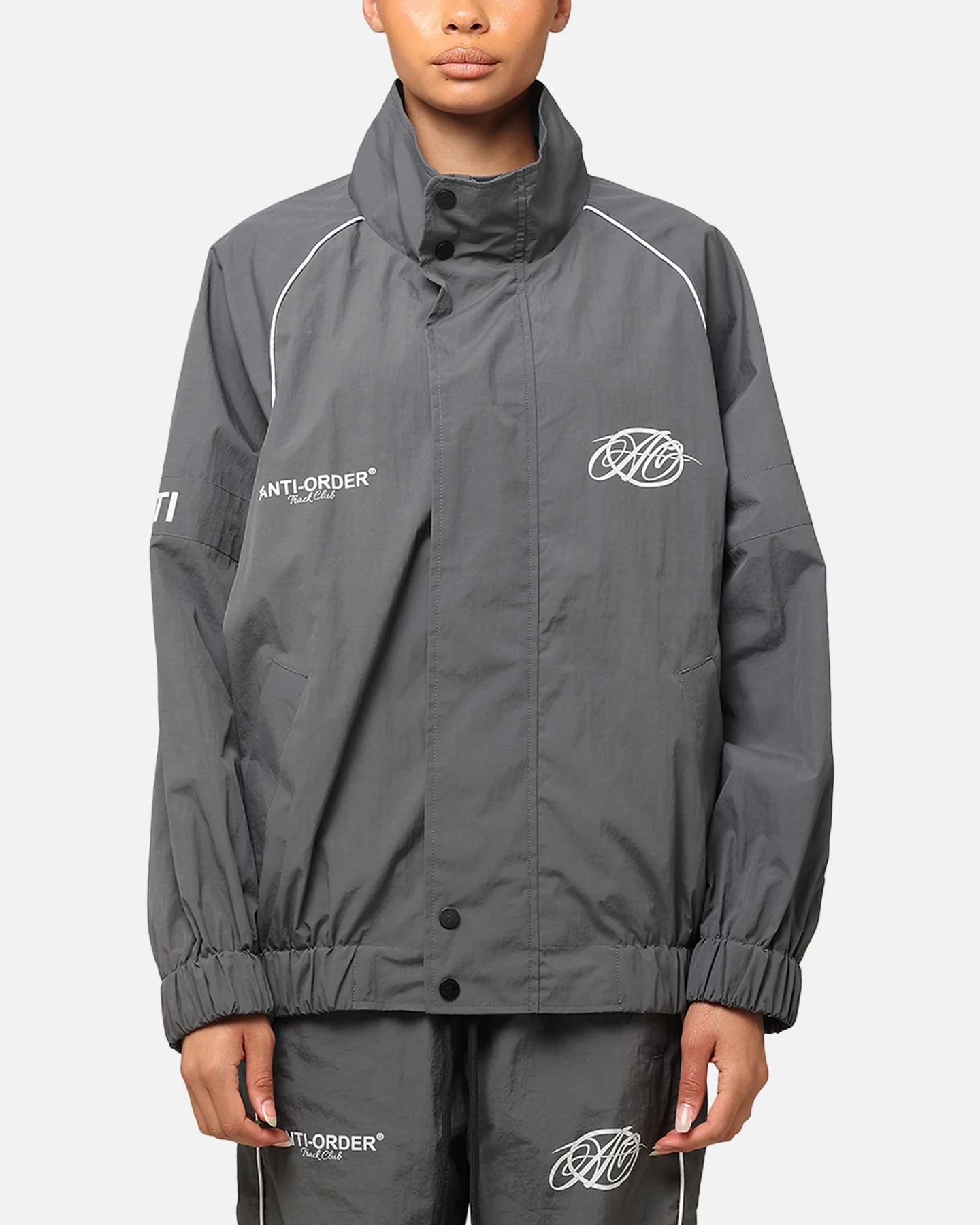 The Anti Order Track Club Windbreaker Jacket Dark Grey/Grey