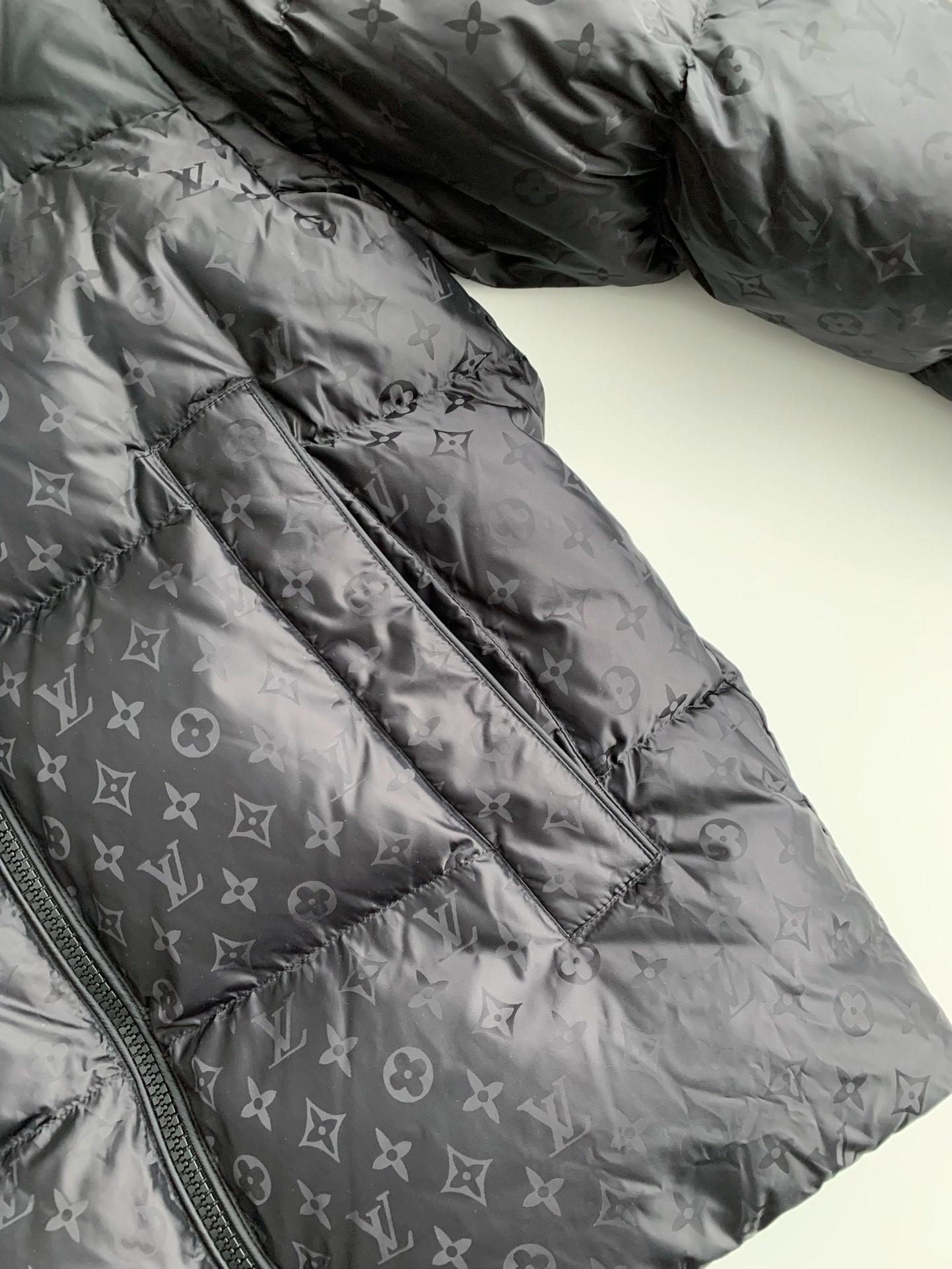 L X V logo labeled down jacket