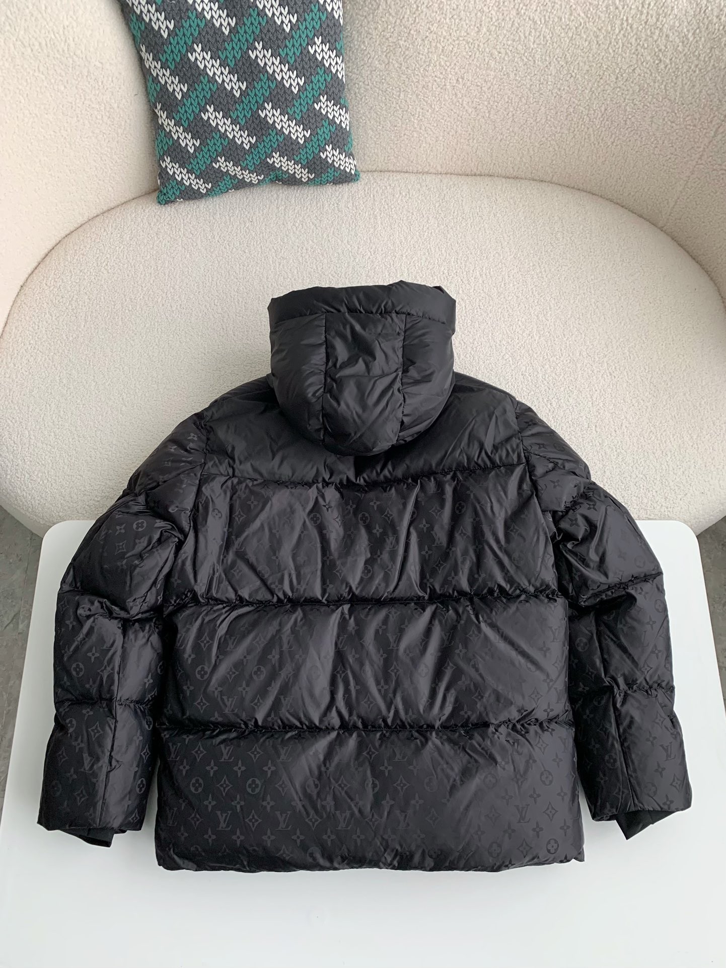 L X V logo labeled down jacket