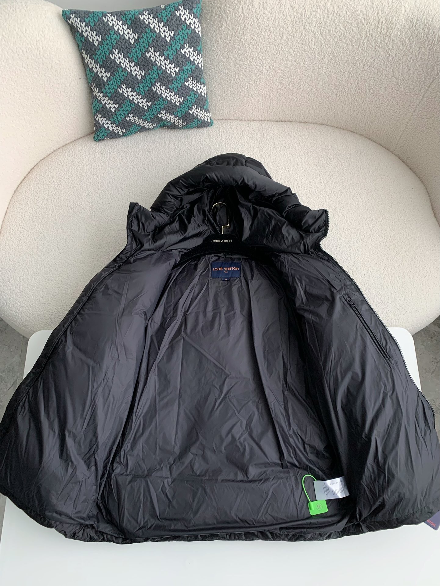 L X V logo labeled down jacket