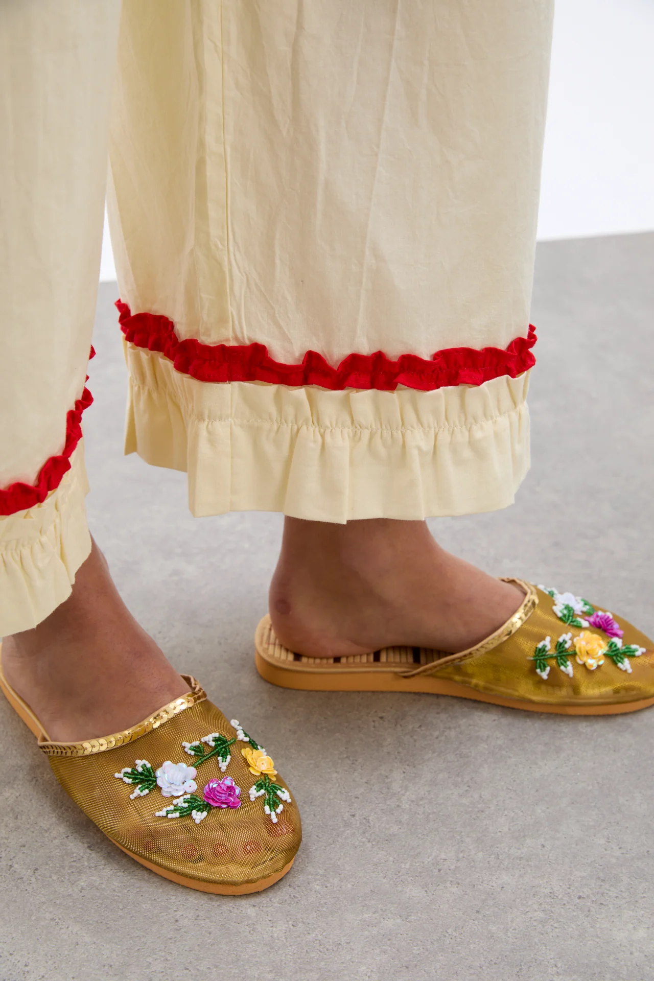 tula frilly hem trouser - butter/red