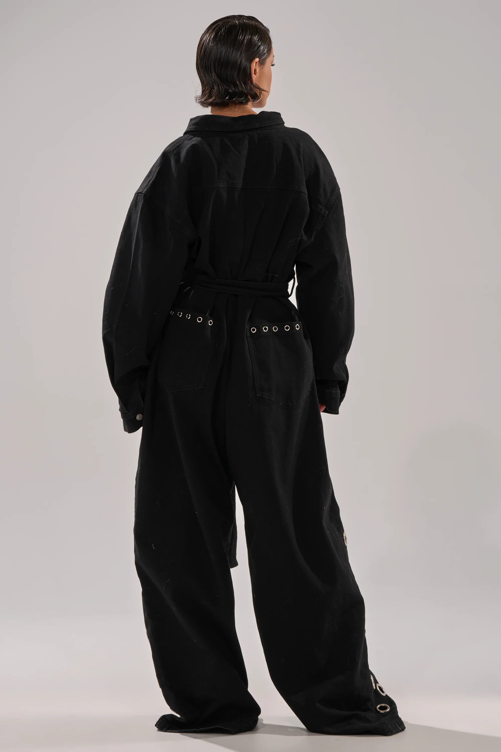 PLAY YOUR CARDS RIGHT DENIM JUMPSUIT WITH GROMMETS