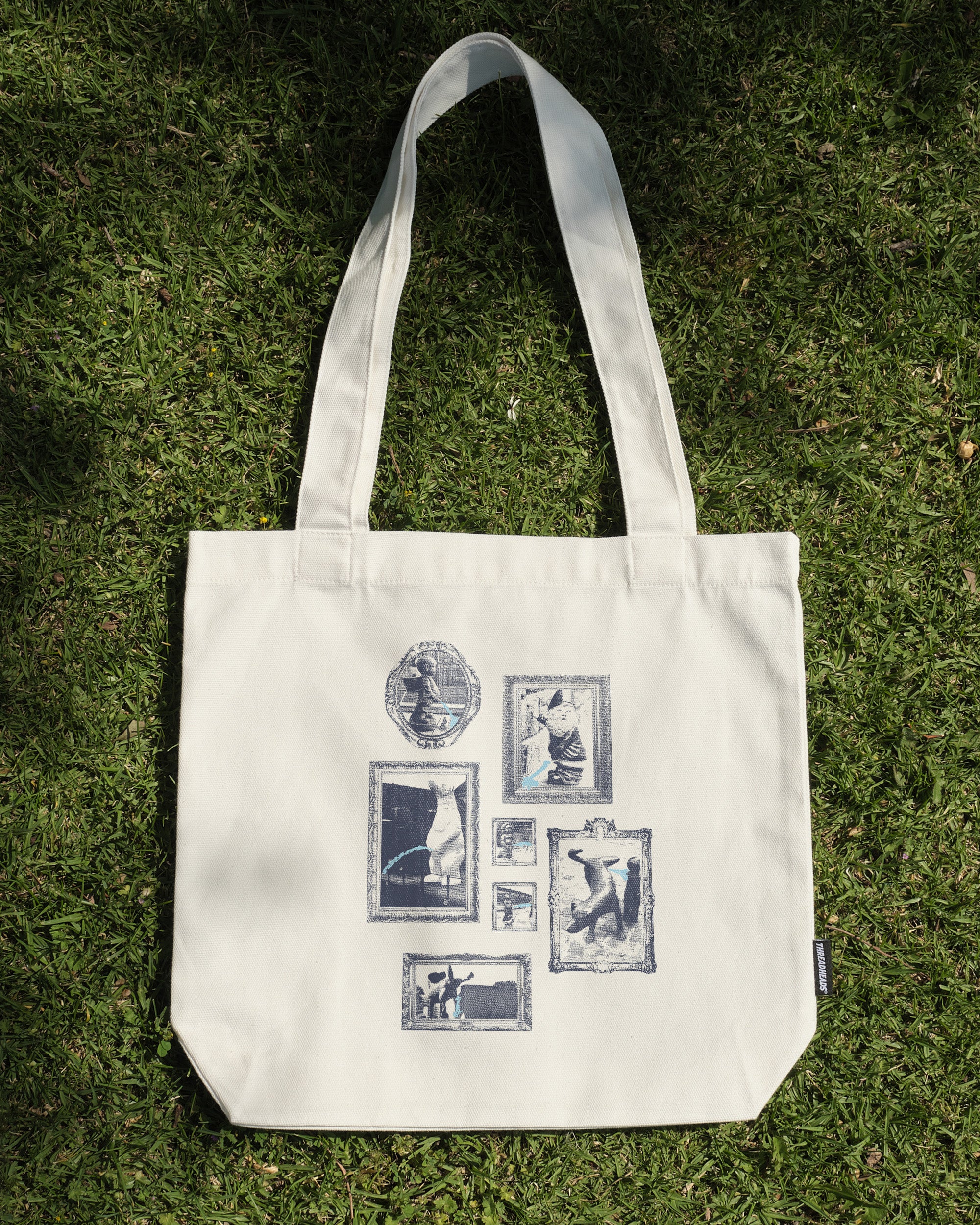 Pissing Statues Tote Bag